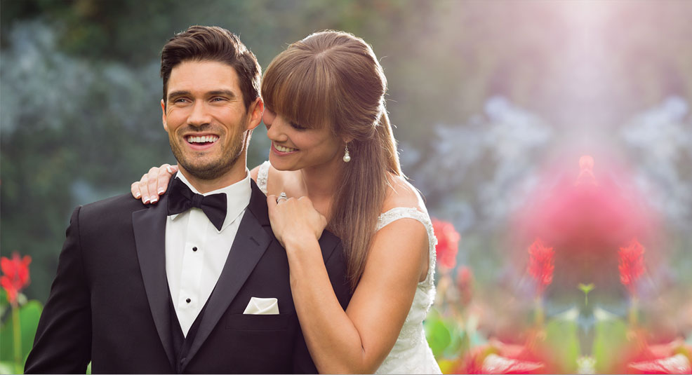 couple dressed in formal-wear embrace